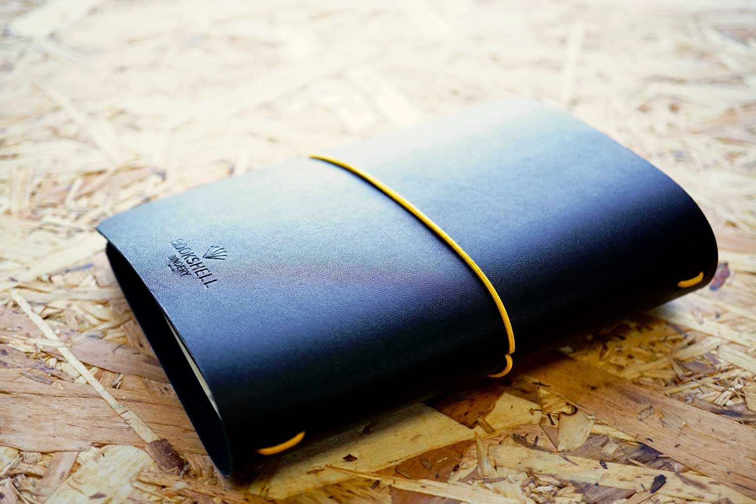 Never-ending journal, Explore. Dream. Discover; A6 leather travel journal with gold foiled compass on the cover, show the back cover