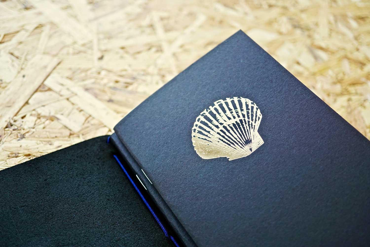 Never-ending journal - Seas the day, leather travel journal, with 3 A6 pocket size inner notebooks, this photo shows the shell illustration embossed in gold foil onto the cover