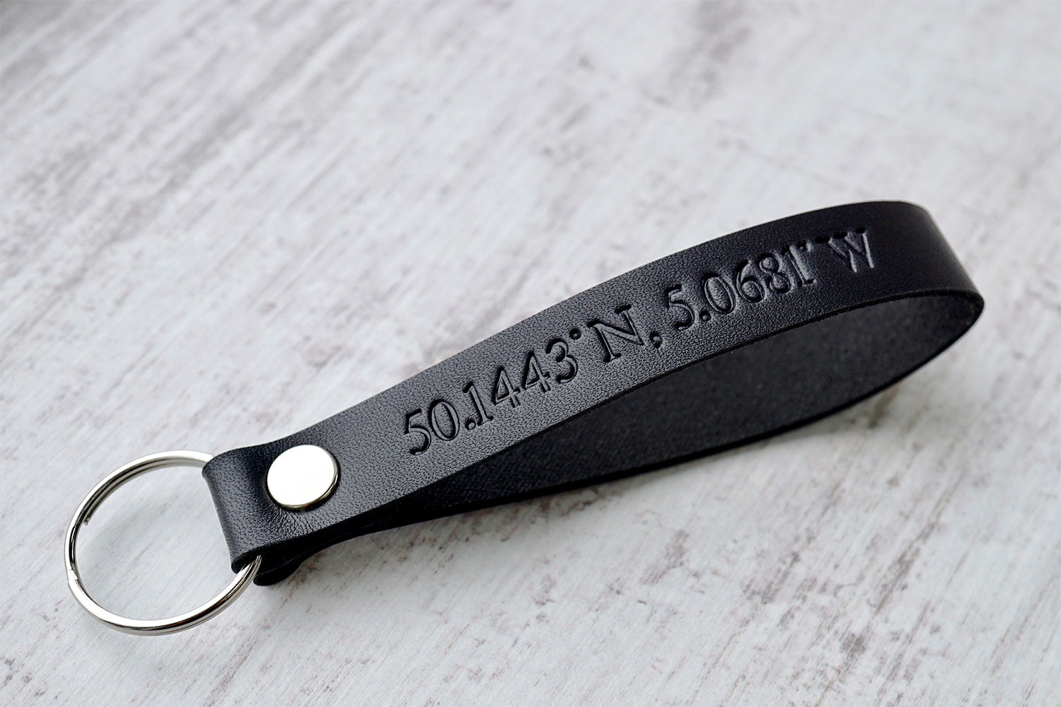 Leather key chain from Bookshell with custom coordinates