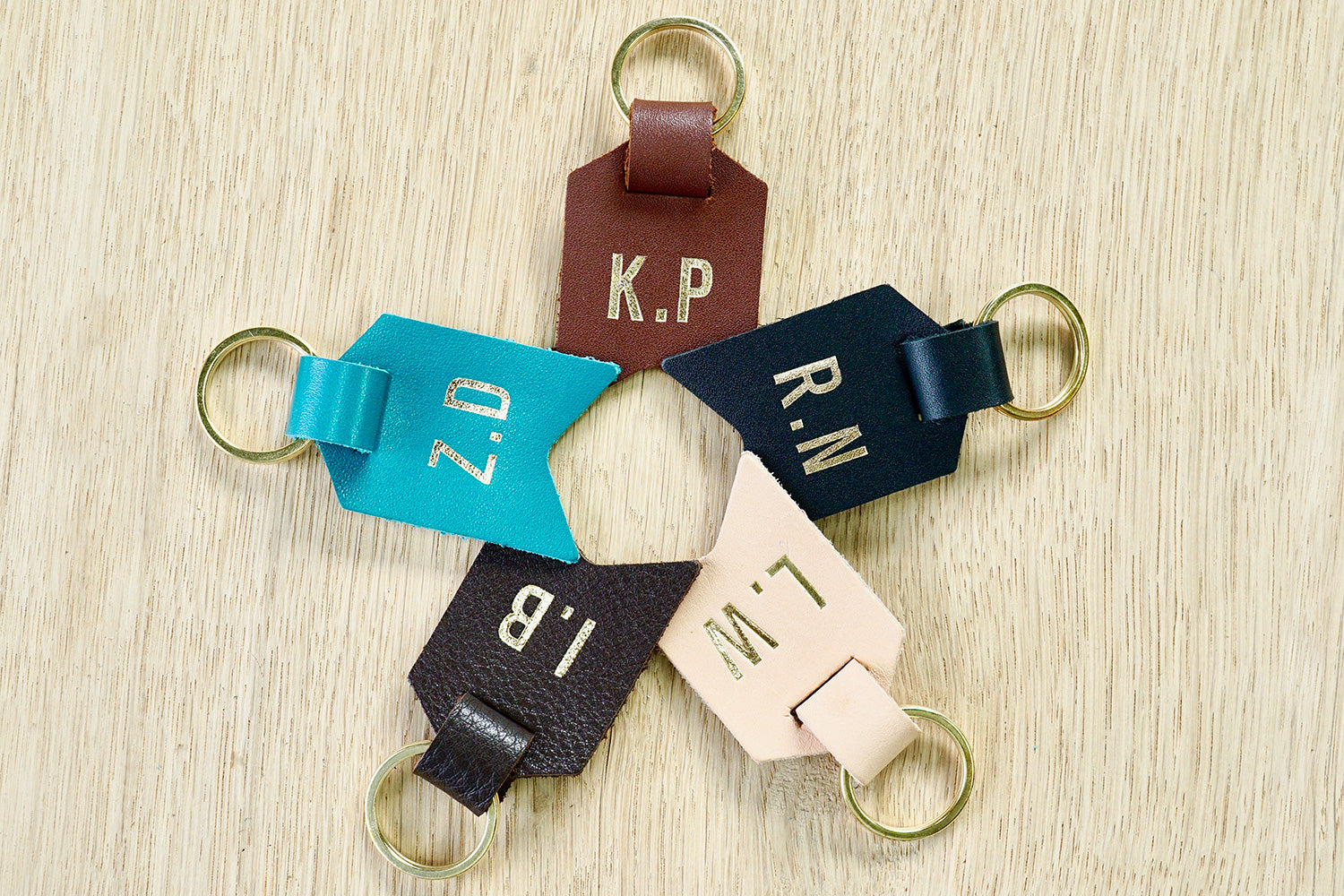 Monogram keychain from Bookshell bindery available in black leather, turquoise blue leather, dark brown leather, light brown leather, Natural (pale pink)