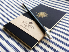 Pocket notebook with choice of gold foil picture from Bookshell, compass