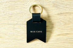Personalised Daddy keyring from Bookshell Bindery with Man cave embossed with gold foil
