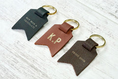 Personalised Daddy keyring from Bookshell Bindery with Buy beer and chocolate, monogram, front door, embossed with gold foil