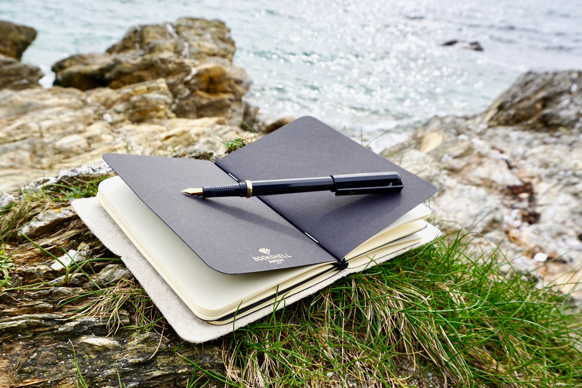Gold Smooth Vegan Leather Journal made from Pinatex Pineapple leather from Bookshell Bindery shown here in the beach