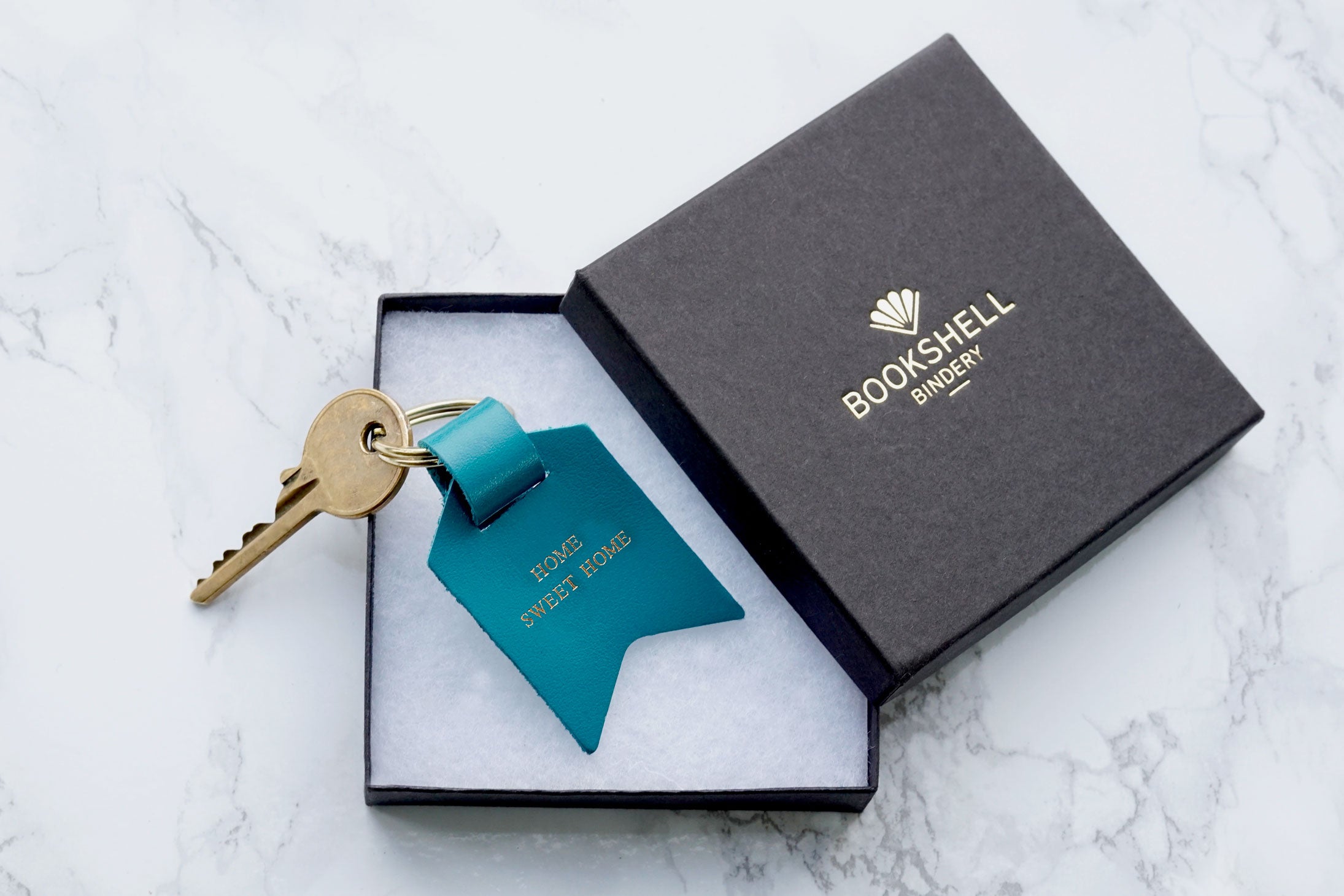 Shown in gift box, Second Sale – Home Sweet Home, blue Leather Keyring